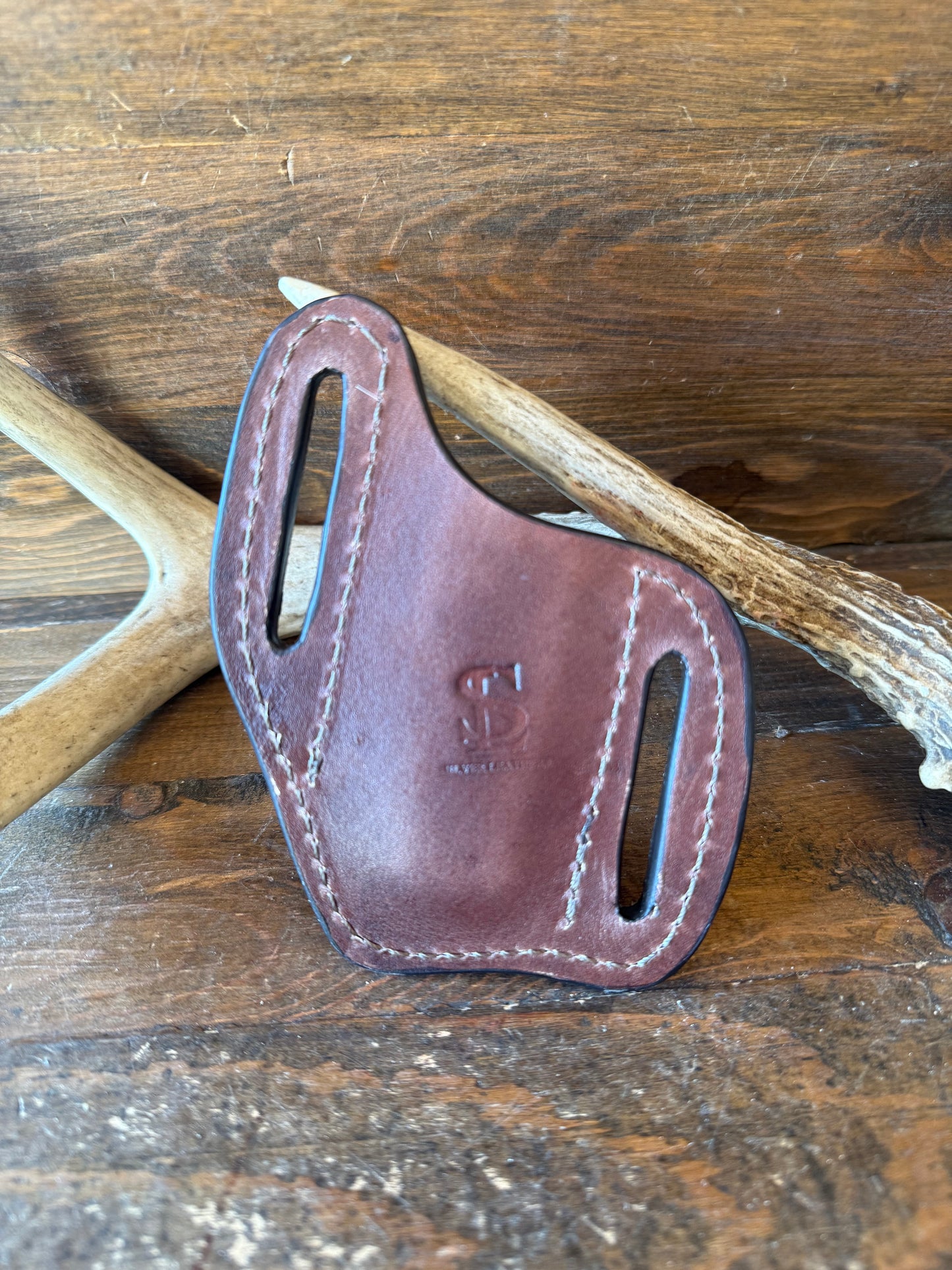 Brown/white. Cowhide knife sheath