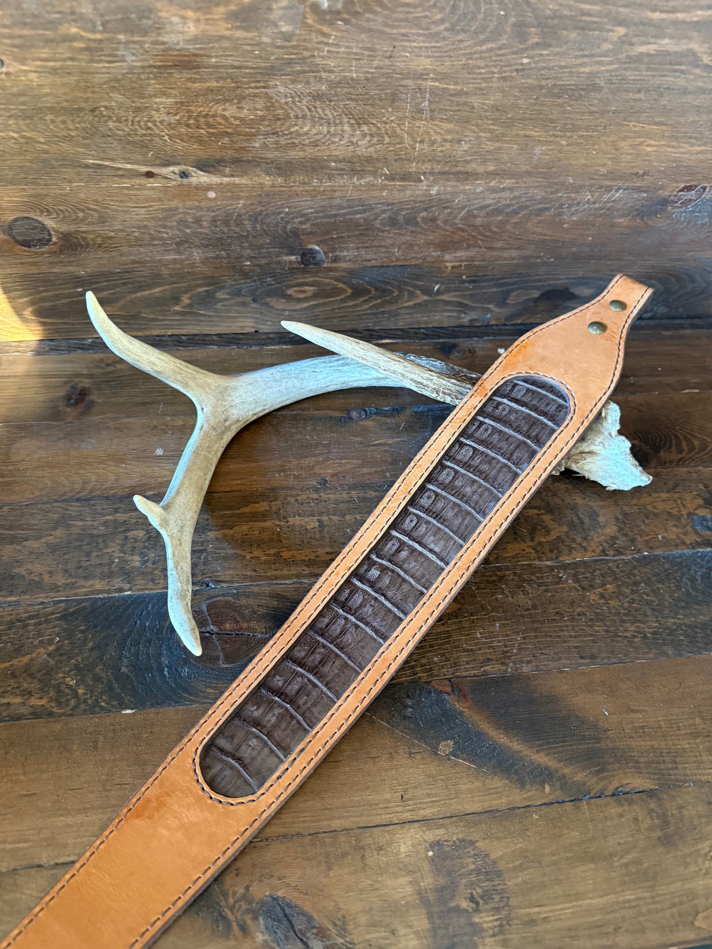 Brown crocodrile skin rifle sling