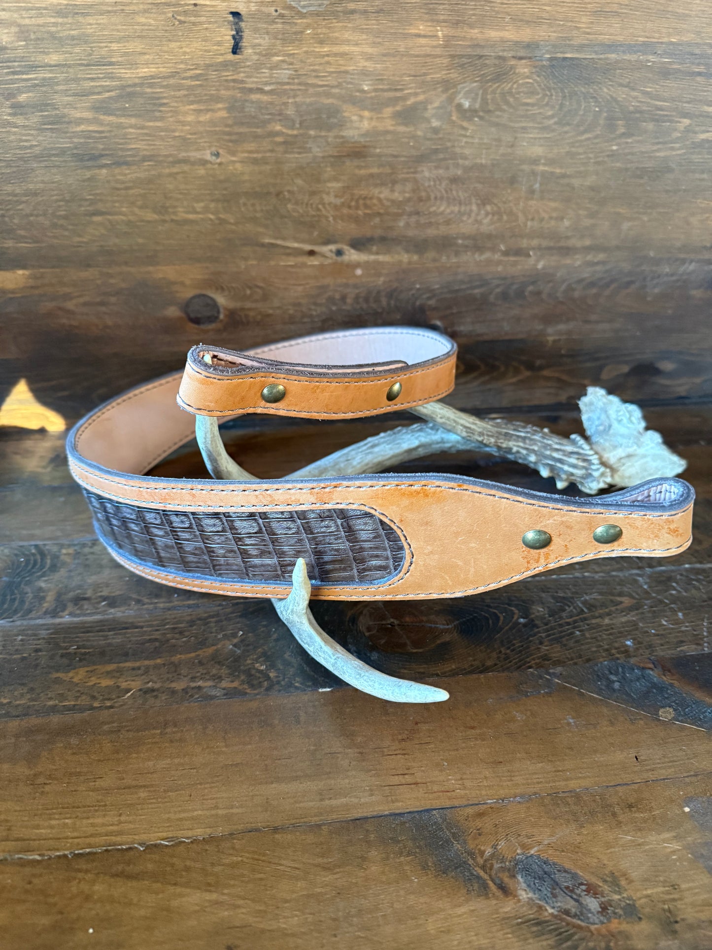Brown crocodrile skin rifle sling