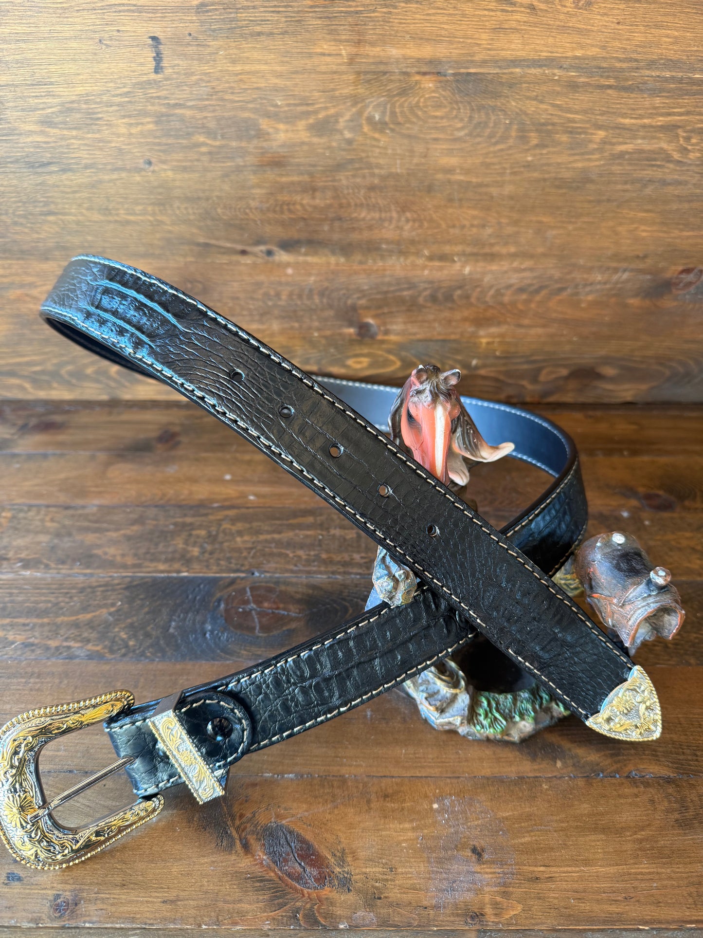 Black crocodile belt. Gold/chrome western buckle.