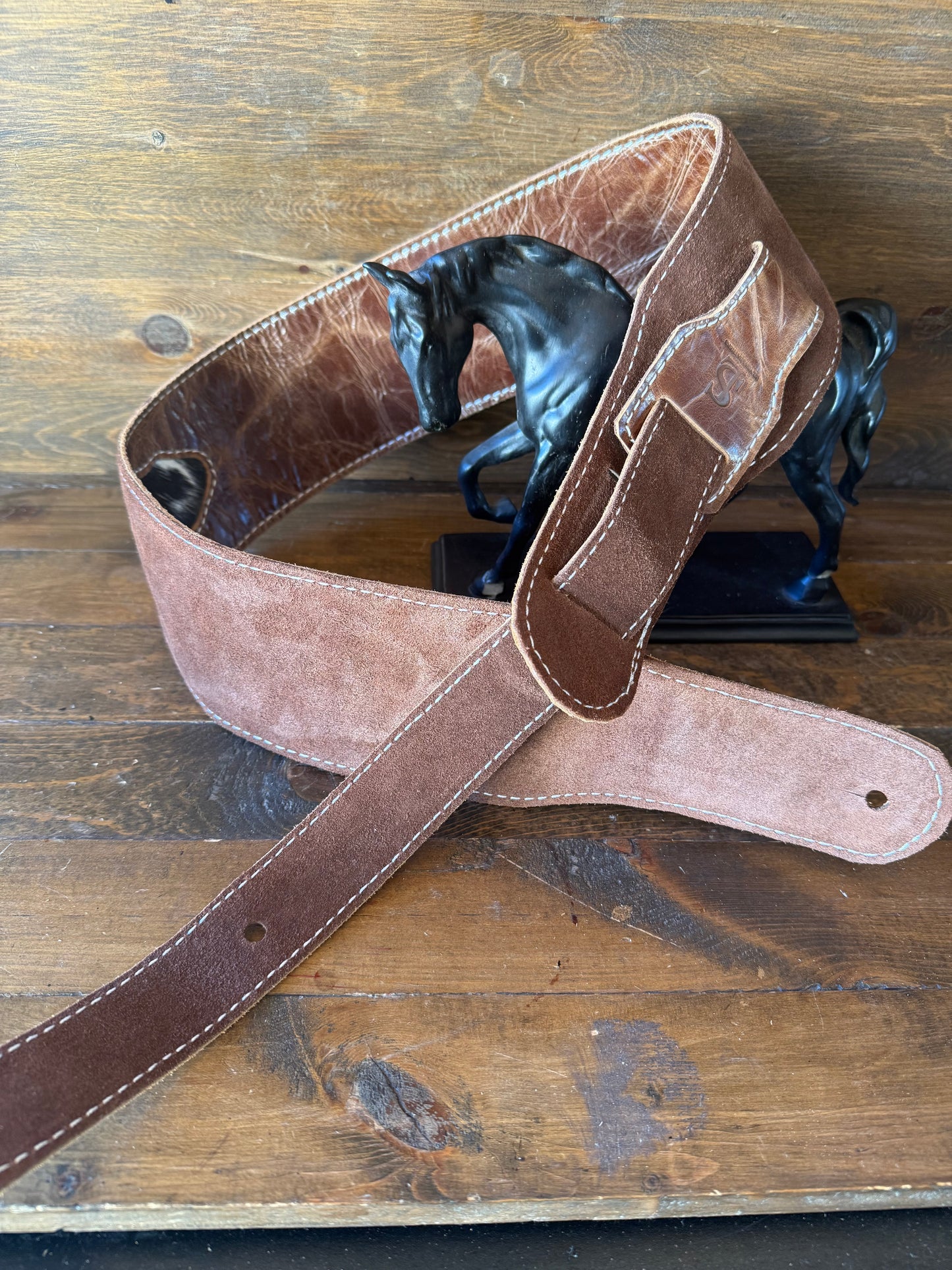 Brown cowhide guitar strap