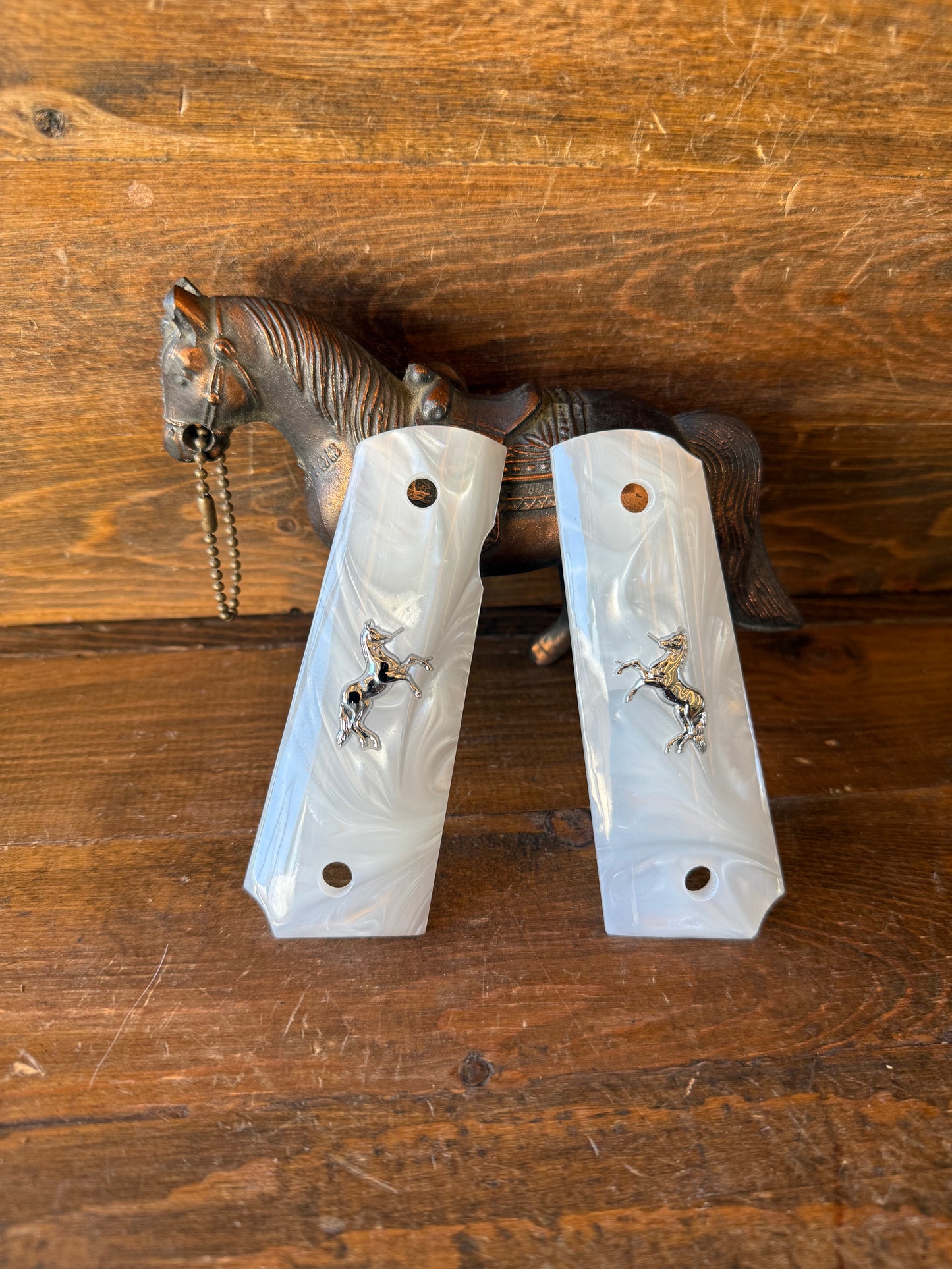 Pearl silver horse grips. (1911)