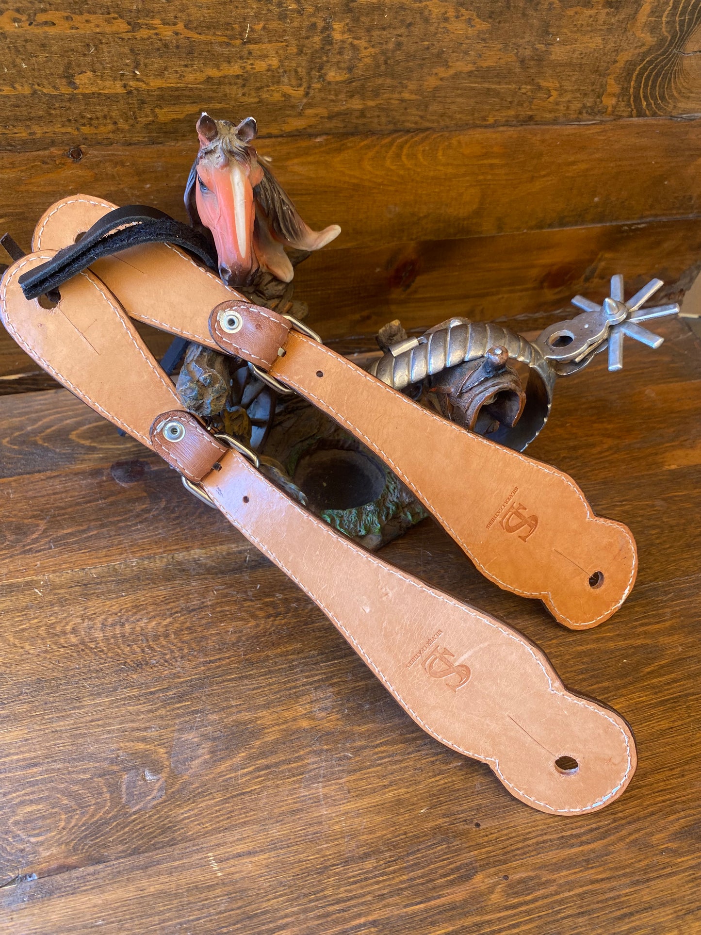 Almond color ostrich spur straps