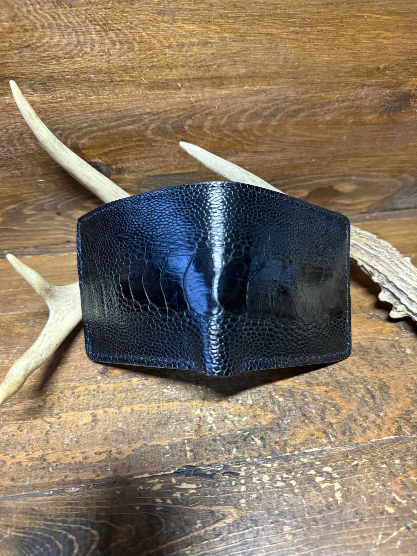 Black ostrich leg skin bifold wallet