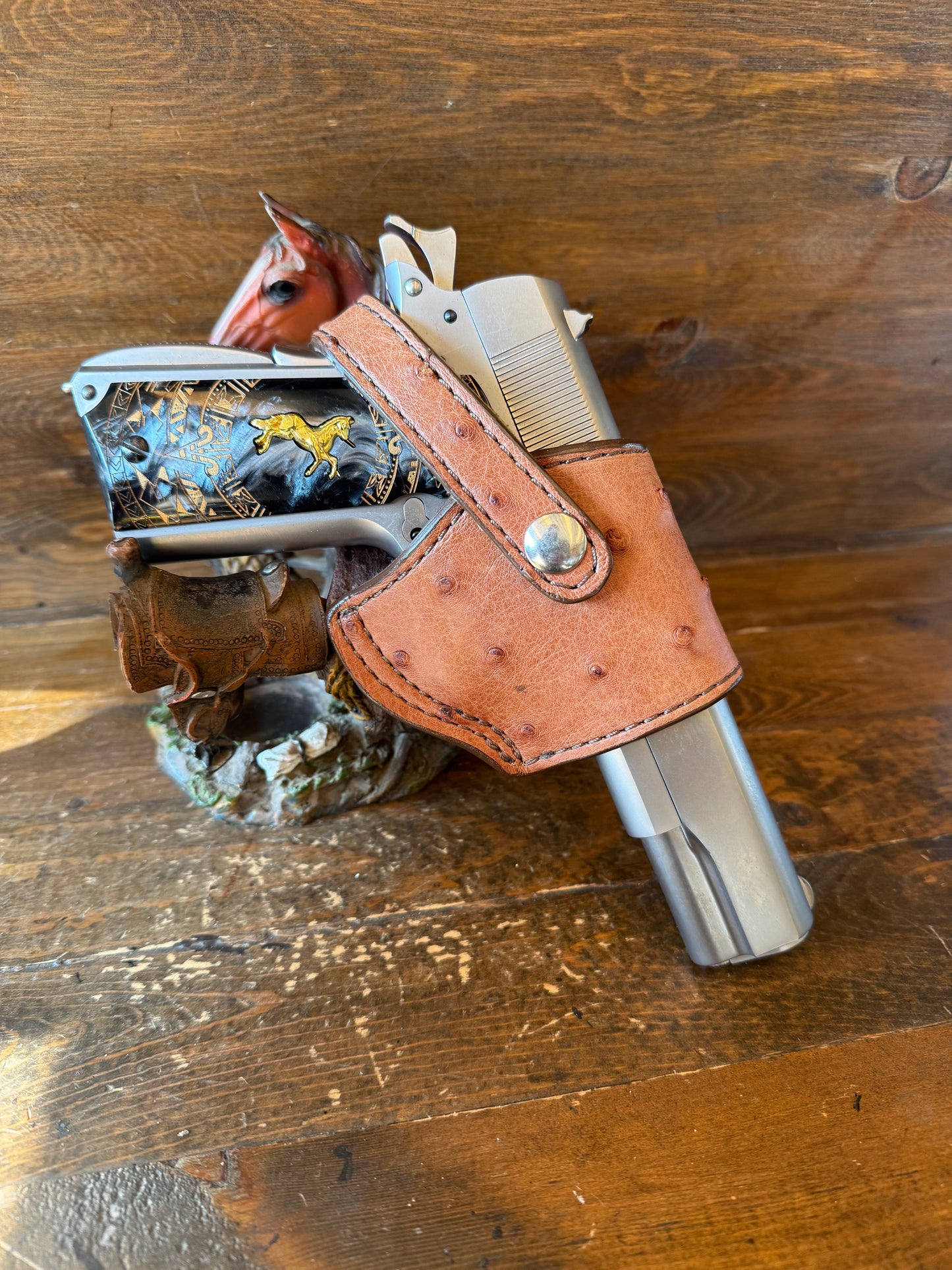 Gerbera/chrome ostrich skin compact holsters. (1911)