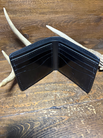 Black ostrich skin bifold wallet