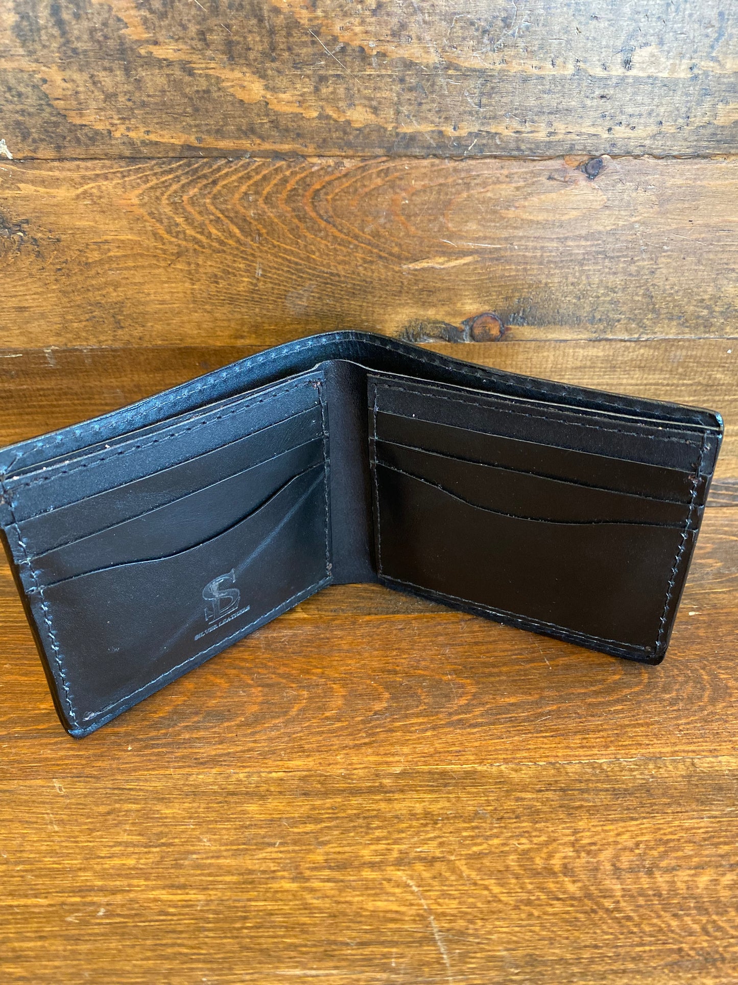 Black ostrich bifold wallet