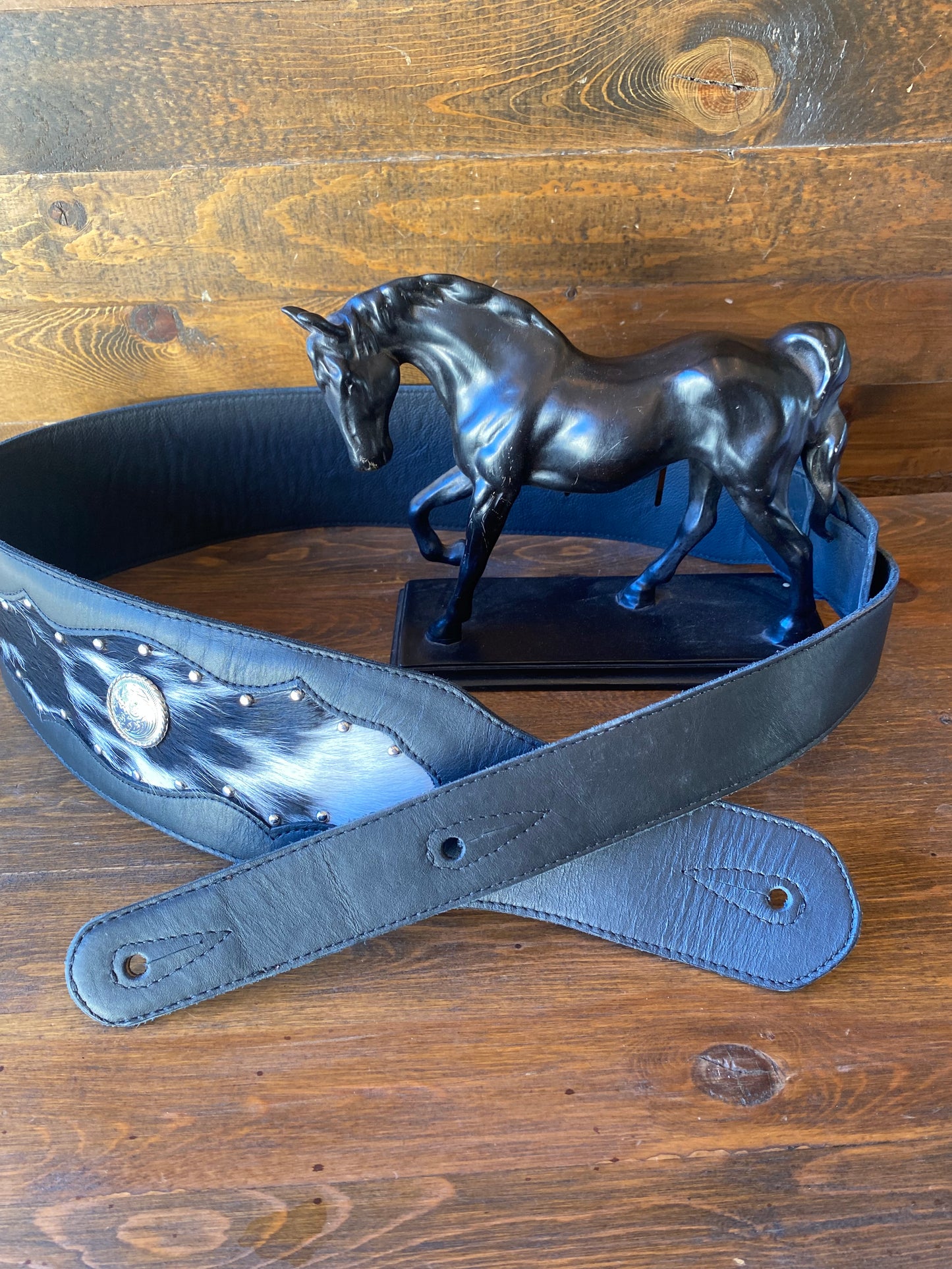 Black cowhide guitar strap w/conchos